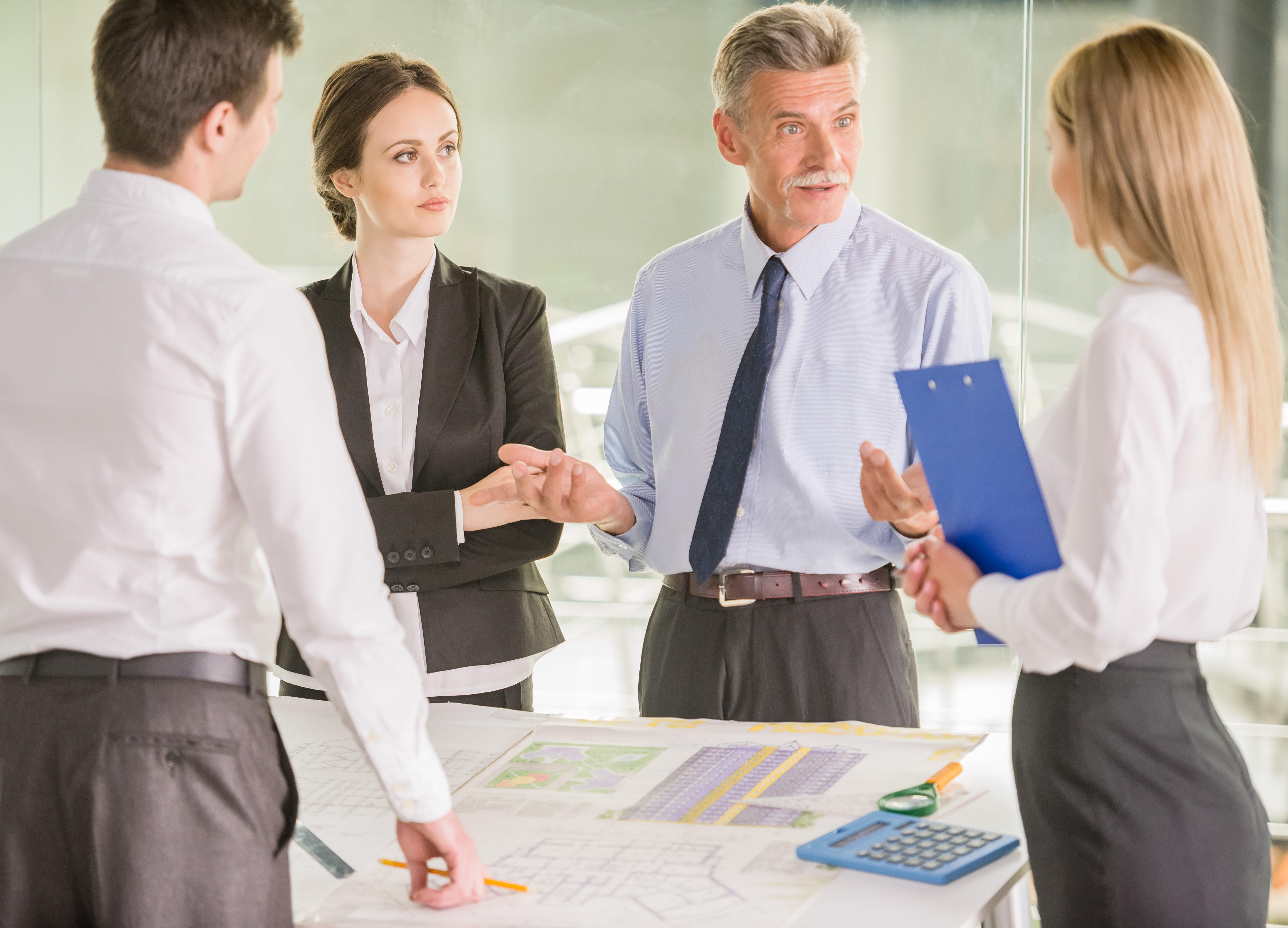 A financial team in a meeting, discussing and reviewing internal control procedures.